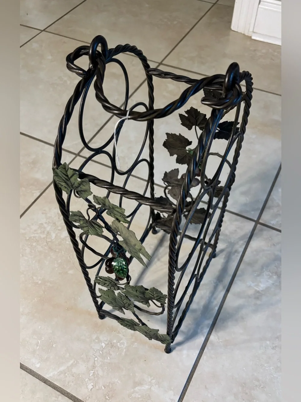 Black Metal Wine Bottle Rack with Decorative Leaf Accents